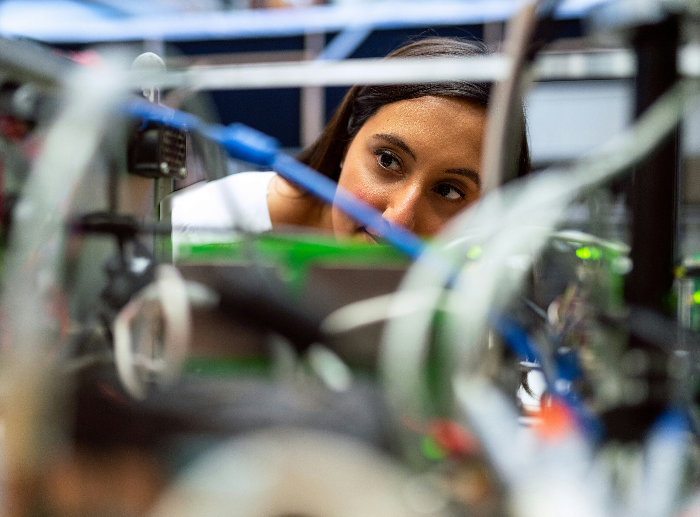 An engineer examining wires