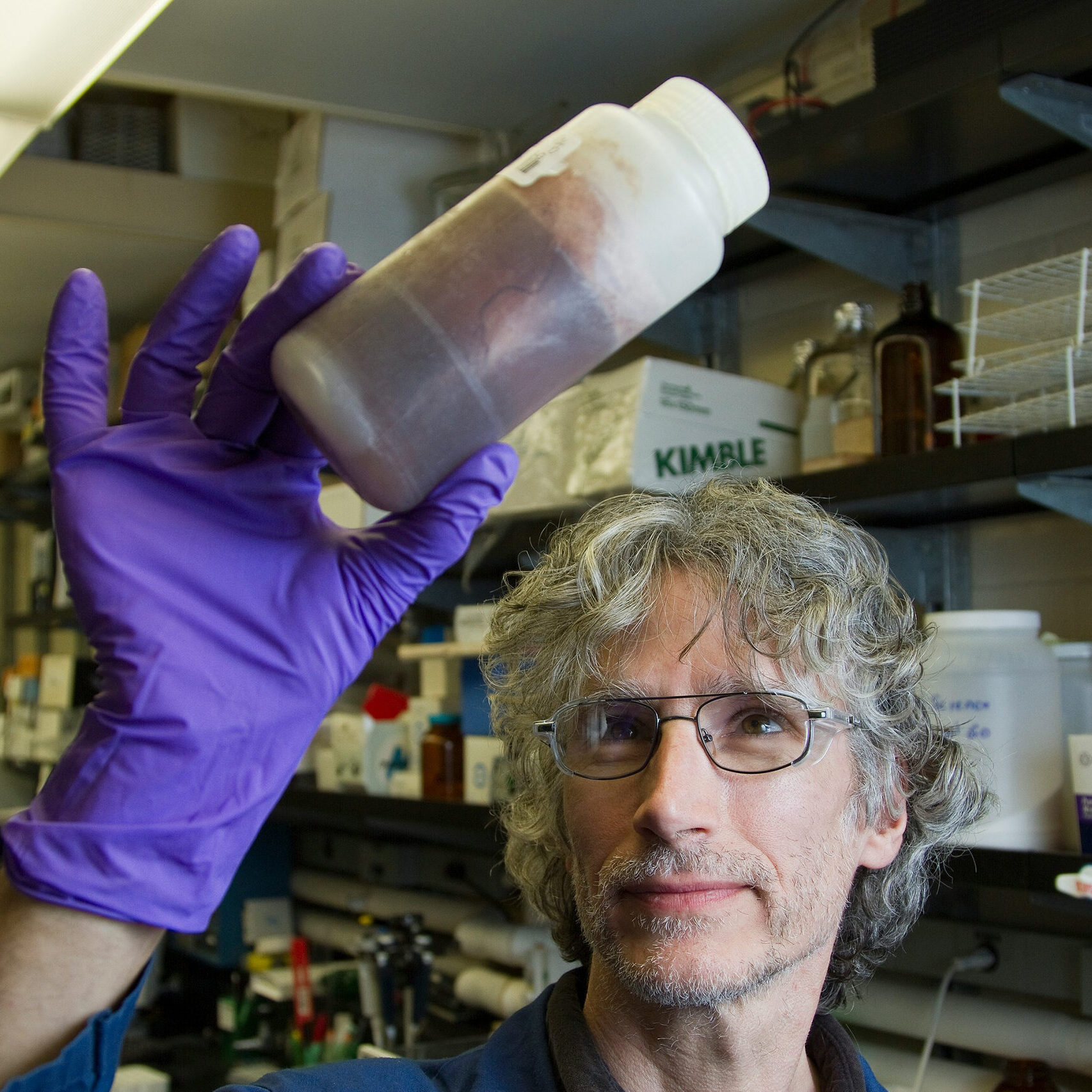 Cancer researcher holding sample